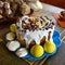 Traditional Easter food in Ukraine, srping holidays and sweet bakery, white glazing decoration with nuts and sugar flowers