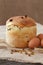 Traditional easter holiday cake sweet bread also called kulich with raisins and eggs on vintage textile