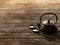 Traditional eastern teapot on old wooden floor 3d render