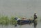 Traditional egyptian bedouin fisherman on river by reeds