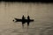 Traditional egyptian bedouin fisherman in silhouette on nile river