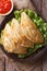 Traditional empanadas and sauce closeup. vertical top view