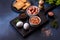 Traditional English breakfast with eggs, toast, sausages, beans, spices and herbs on a grey ceramic plate