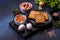 Traditional English breakfast with eggs, toast, sausages, beans, spices and herbs on a grey ceramic plate