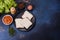 Traditional English breakfast with eggs, toast, sausages, beans, spices and herbs on a grey ceramic plate