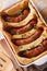Traditional English dishes toad in the hole close-up vertical to