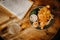 Traditional english fish and chips on a wooden table, with a pint and a menu