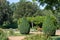 Traditional English garden with arbour and trees