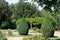 Traditional English garden with arbour and trees