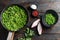 Traditional English Mushy Peas  ingredients for fish and chips in frying pan and peas in bowl with mint shallot pepper and salt