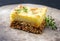 Traditional English shepherd pie in a rustic design plate