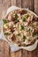 Traditional Estonian festive dish Mulgikapsas of pork, barley and sauerkraut closeup on the table. Vertical top view