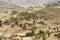 Traditional Ethiopian wooden village houses with straw roofs in the valley near Gondar, Ethiopia.