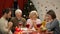 Traditional family praying before Christmas meal, belief in god, Christianity