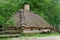 Traditional farmer's house under the thatch roof in open air museum