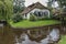 Traditional farmhouse with a thatched roof in Giethoorn, known as Dutch Venice