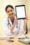 Traditional female doctor holding tablet computer