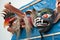 Traditional festival masks hanging on a wall from Paucartambo`s religious festival of Virgen del Carmen.