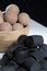 Traditional Finnish cuisine: A closeup of the traditional Finnish delicacy of black licorice against a dark background. A bowl of