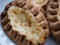 Traditional Finnish Karelian pies on a plate with black background