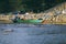 Traditional fisherman boat moored over beautiful sea view and sandy beach under bright sunny day