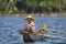 Traditional fisherman in dugout canoe in Sri Lanka