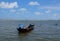 A traditional fisherman's boat by the shore at Jubakar Pantai, Tumpat, Malaysia during beautiful daytime in background.