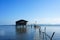 Traditional fisherman\'s house on stilts in the sea.