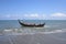 A traditional fishing boat on the Alue Naga beach, Banda Aceh, Indonesia, which is starting to move away from the shoreline to pre