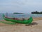 Traditional fishing boat leaning on the beach.