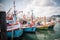 Traditional fishing boats dock at Bang Saray Pier, Sattahip District, Thailand