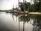 A traditional fishing boats parked on the jetty river in the morning.