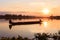 Traditional fishing pirogue at sunset on the Huai Luang Reservoir