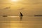 Traditional fishing sailing boat during sunset on Indian ocean in island Zanzibar, Tanzania, Africa