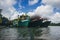 Traditional fishing village with lovely sky and fishing boat moored near the shore