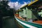 Traditional fishing village with lovely sky and fishing boat moored near the shore