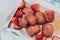 Traditional French beignets doughnuts with strawberry and powdered sugar.