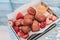 Traditional French beignets doughnuts with strawberry and powdered sugar.