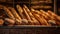 Traditional French boulangerie showcasing freshly baked baguettes cooling on a rustic wooden rack