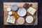 Traditional French cheese platter with Spanish dulce de membrillo  on a wooden board