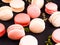 traditional french colorful macarons, dark background