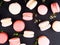 traditional french colorful macarons, dark background