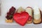 Traditional French dessert with plush heart and an inscription I Love You. Beautiful eclairs with icing and berries.