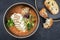 Traditional French fish soup with codfish and crouton in a modern design bowl