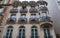 Traditional French house with typical balconies and windows. Paris.