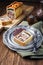 Traditional French Pate en croute with goose meat and liver with quince cheese on a pewter plate