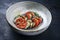 Traditional French ratatouille with tomatoes, eggplant and zucchini in a Nordic design bowl