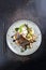 Traditional fried Japanese coalfish with vegetable and rice on a design plate