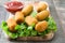 Traditional fried Spanish croquetas croquettes with ketchup