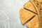 Traditional galette des Rois with decorative crown on grey marble table, flat lay. Space for text